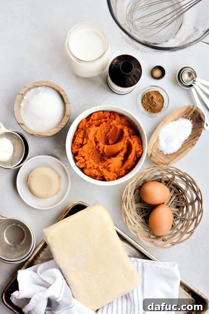 Sheet Pan Pumpkin Pie 4 All essential ingredients for Pumpkin Slab Pie neatly arranged on a counter