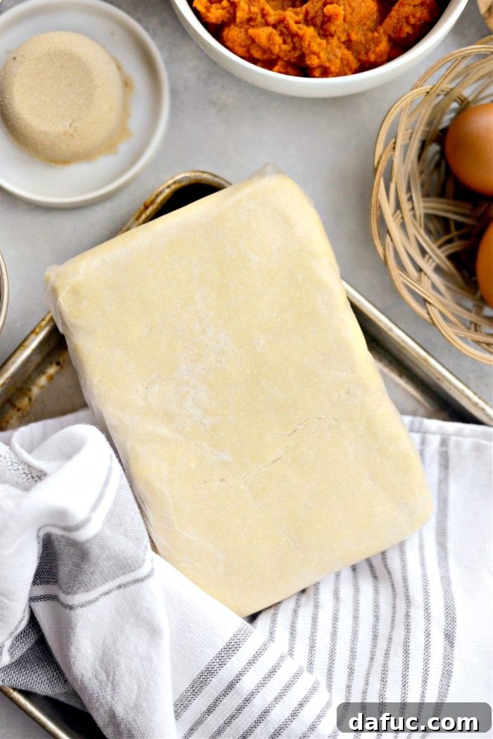 Sheet Pan Pumpkin Pie 5 Chilled pie dough shaped into a rectangle, wrapped and ready for rolling