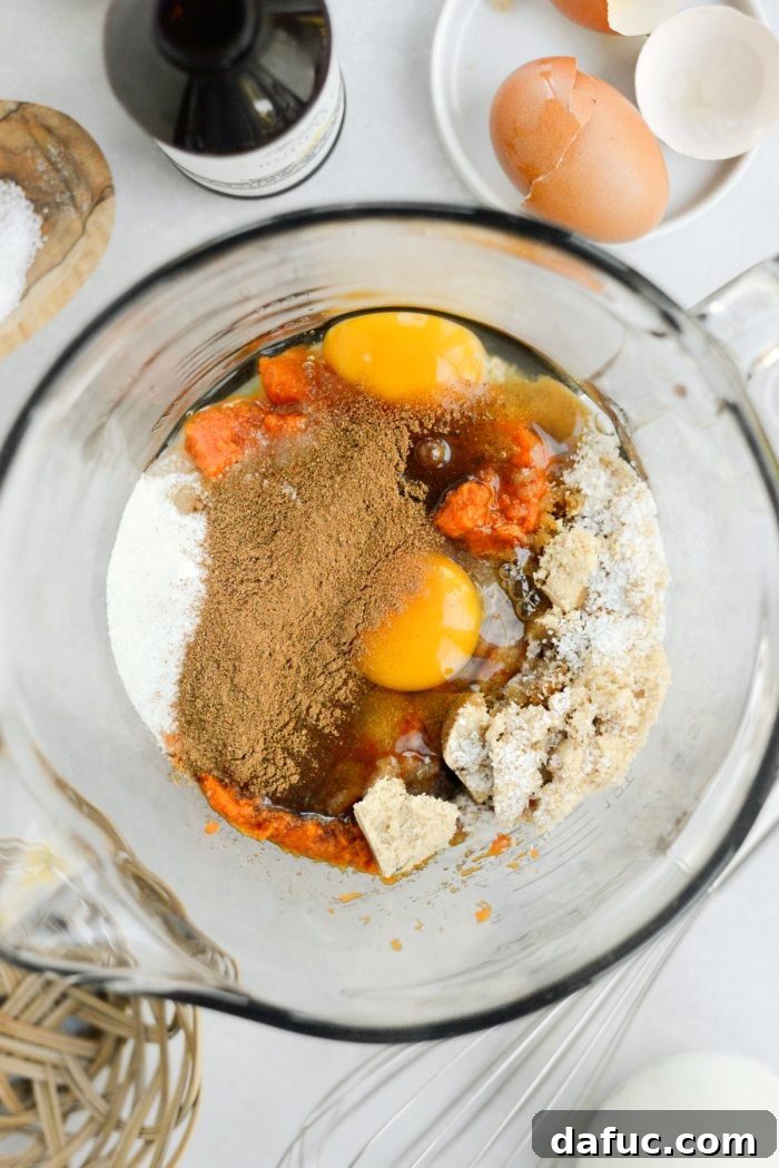 Sheet Pan Pumpkin Pie 10 All wet and dry ingredients for the pumpkin pie filling gathered in a mixing bowl