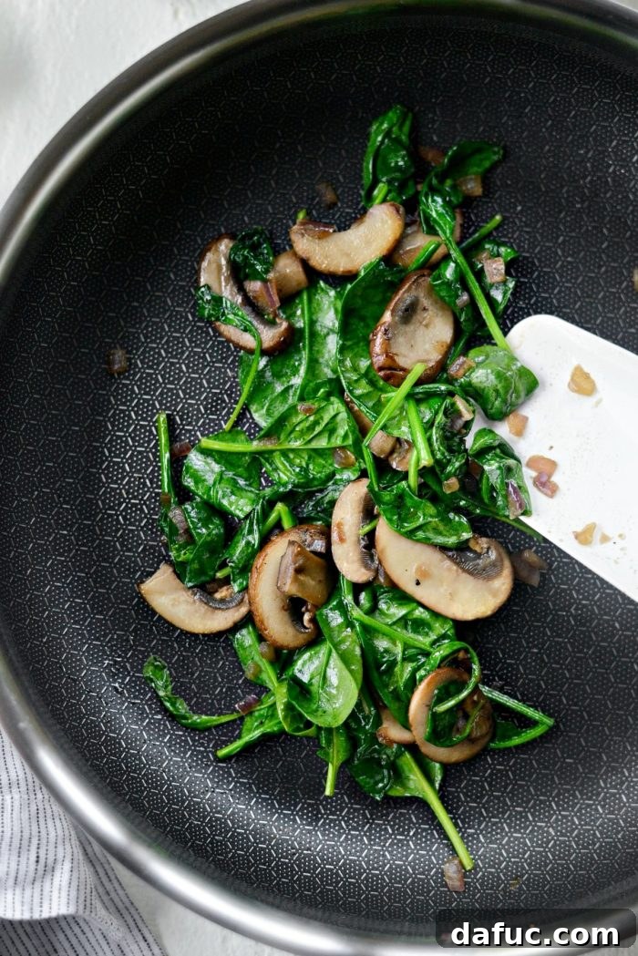 Vibrant Spinach and Mushroom Scramble 11 Stir and sauté until the spinach wilts