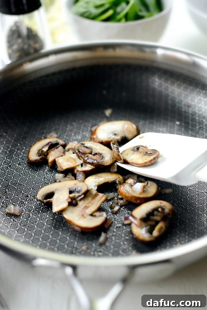 Vibrant Spinach and Mushroom Scramble 9 Sautéed onions and mushrooms are golden brown and tender