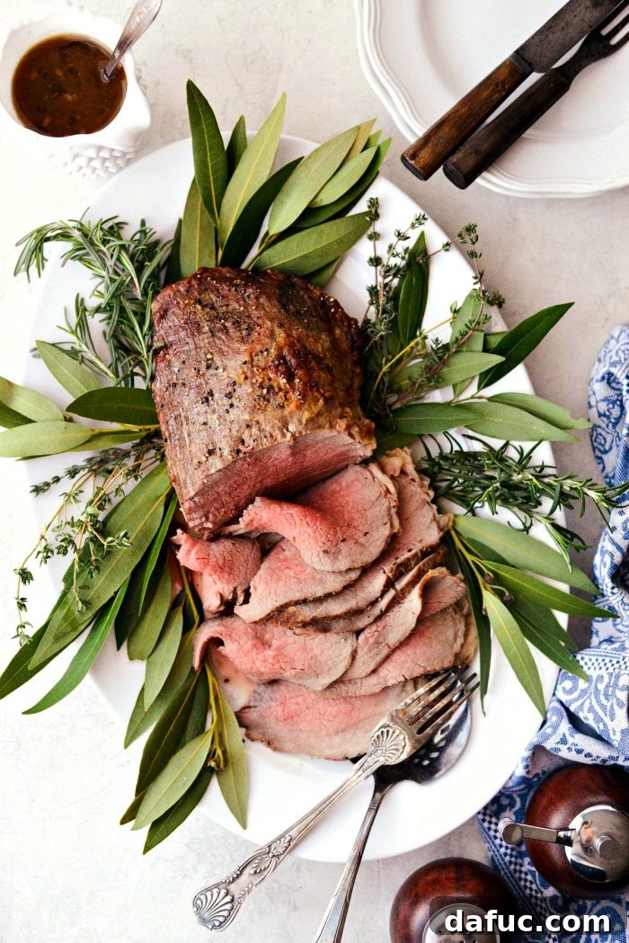 Plated Easy Roast Beef with a side of delicious au jus.