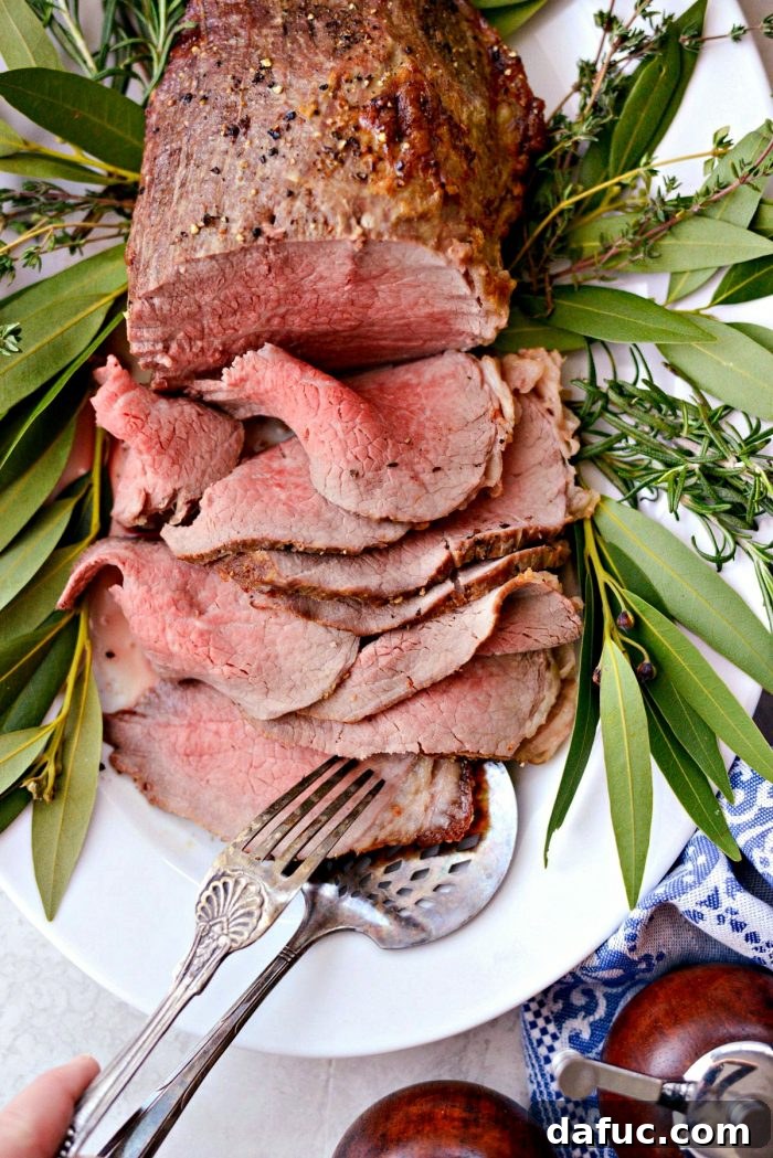 A close-up of the succulent Easy Roast Beef with Au Jus, ready to enjoy.