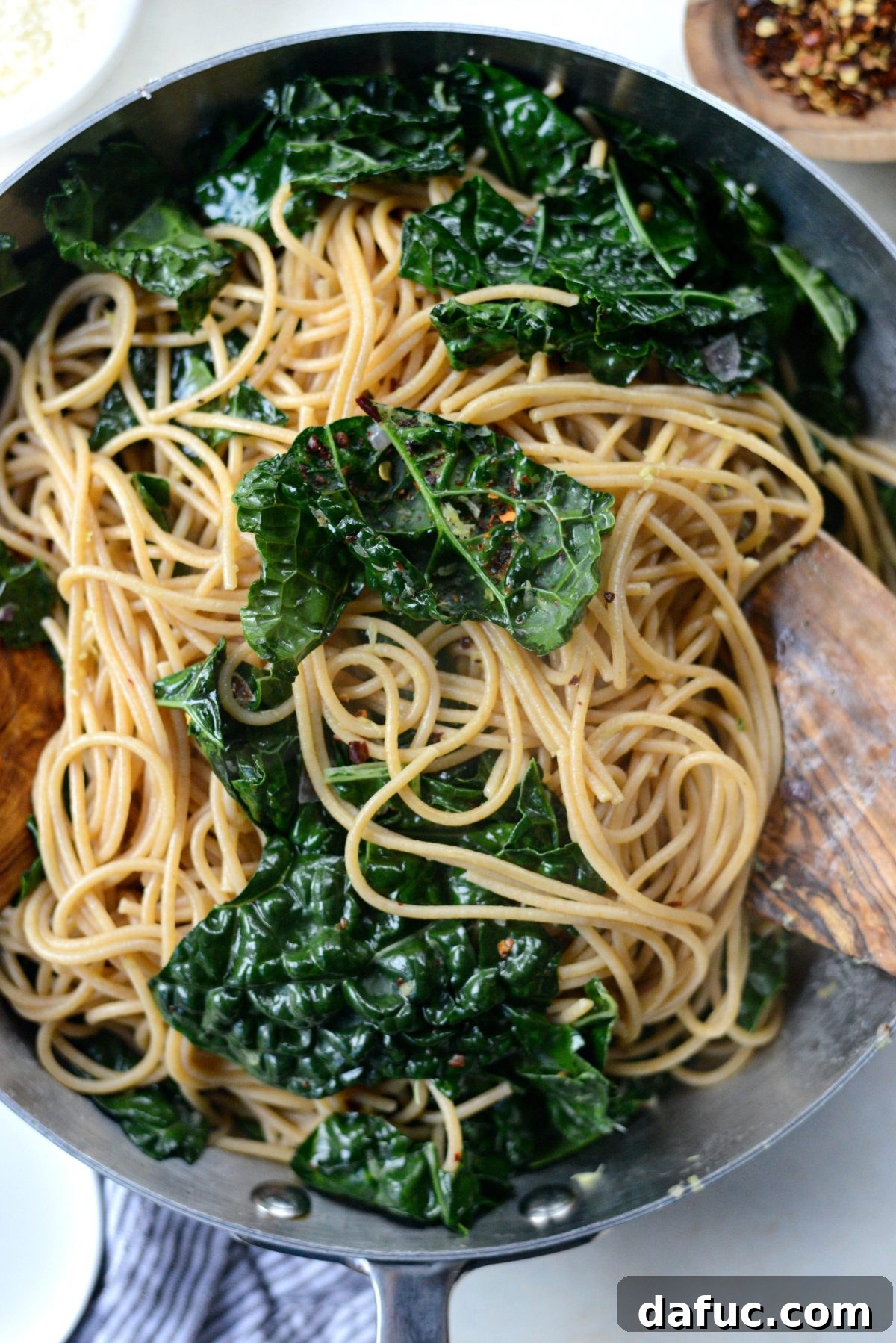Tangy Lemon Kale Spaghetti with Olives and Parmesan 14 Tossing spaghetti with kale and lemon sauce