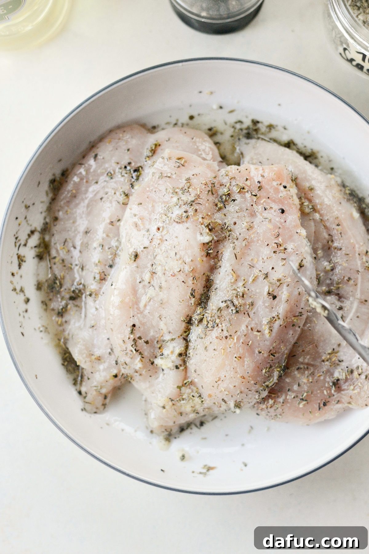 Tuscan Chicken and Potato Sheet Pan Dinner - Chicken coated in marinade