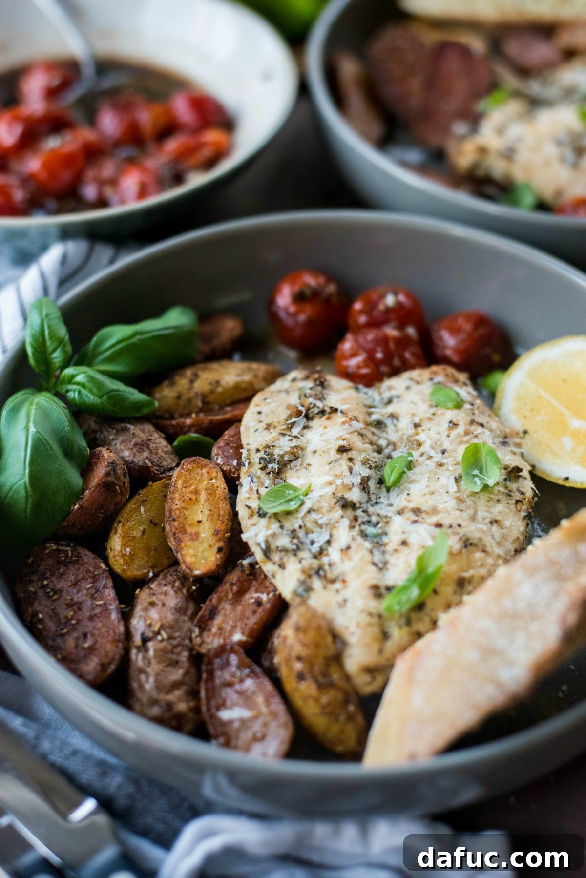 Close-up of Tuscan Chicken and Potato Sheet Pan Dinner, showcasing crispy potatoes and juicy chicken