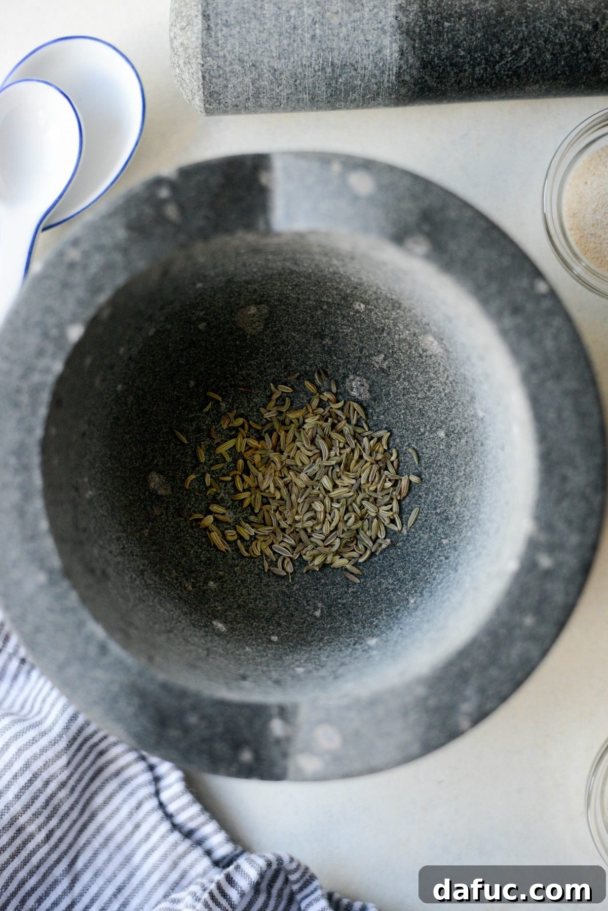 Handcrafted Tuscan Seasoning 5 fennel seeds in mortar