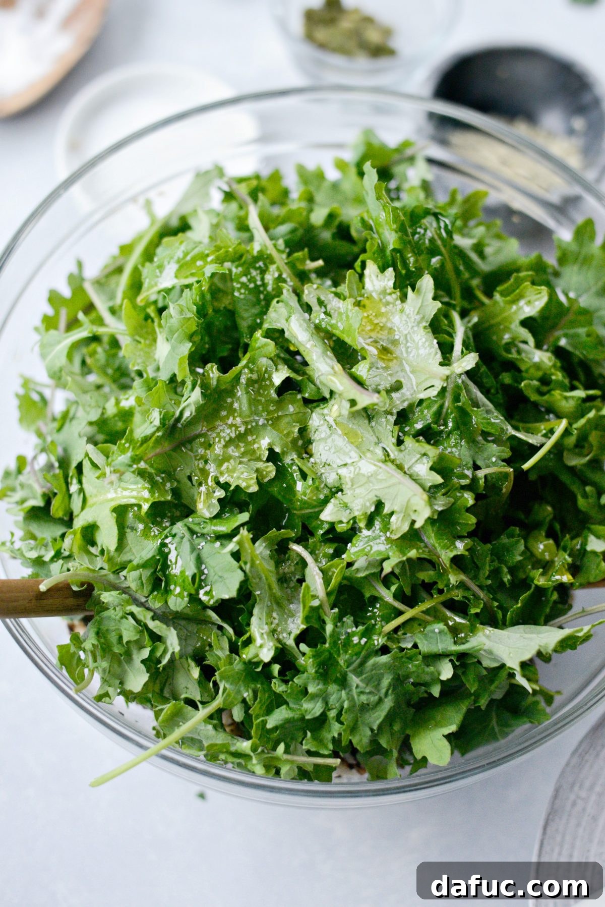 Warm Roasted Greens & Florets Salad 11 bay kale, lemon juice, olive oil and salt added to the bowl.