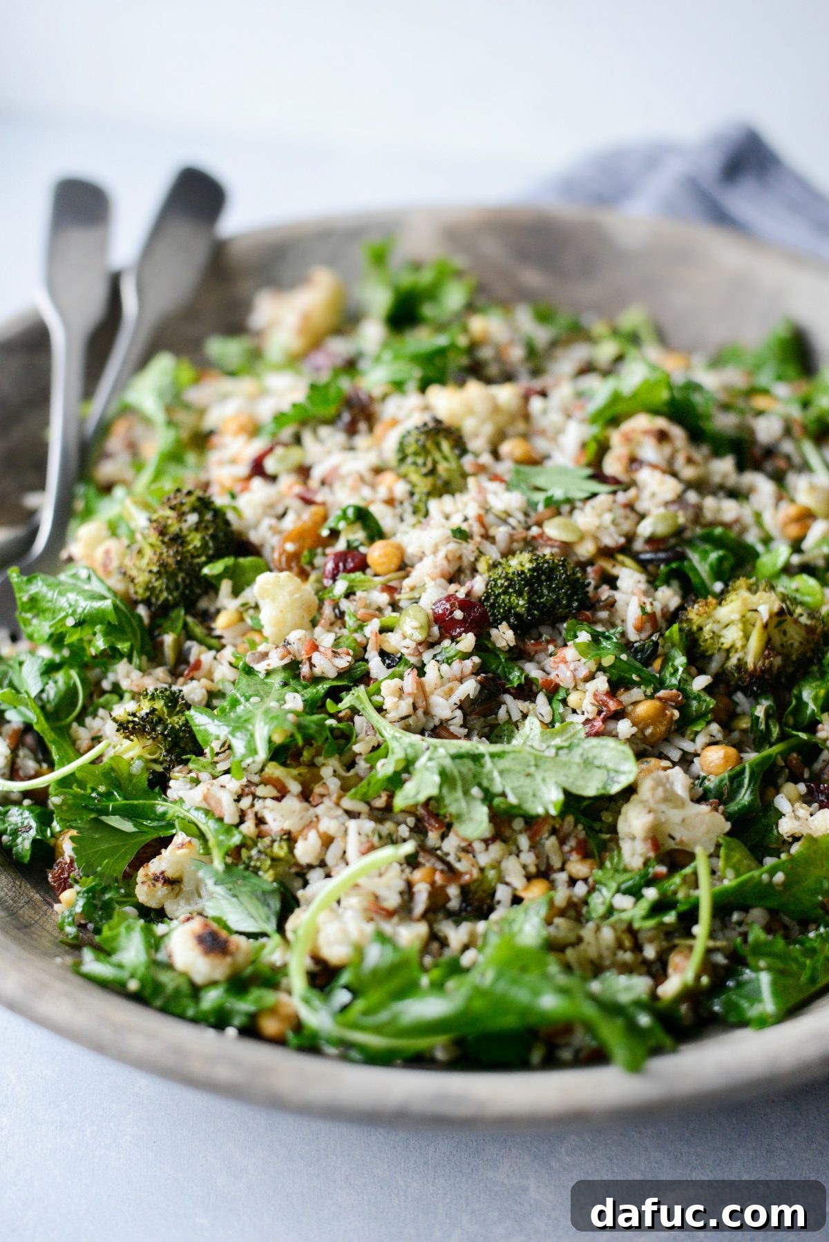 Warm Roasted Greens & Florets Salad 3 Roasted Broccoli Cauliflower Kale Salad in wooden bowl.