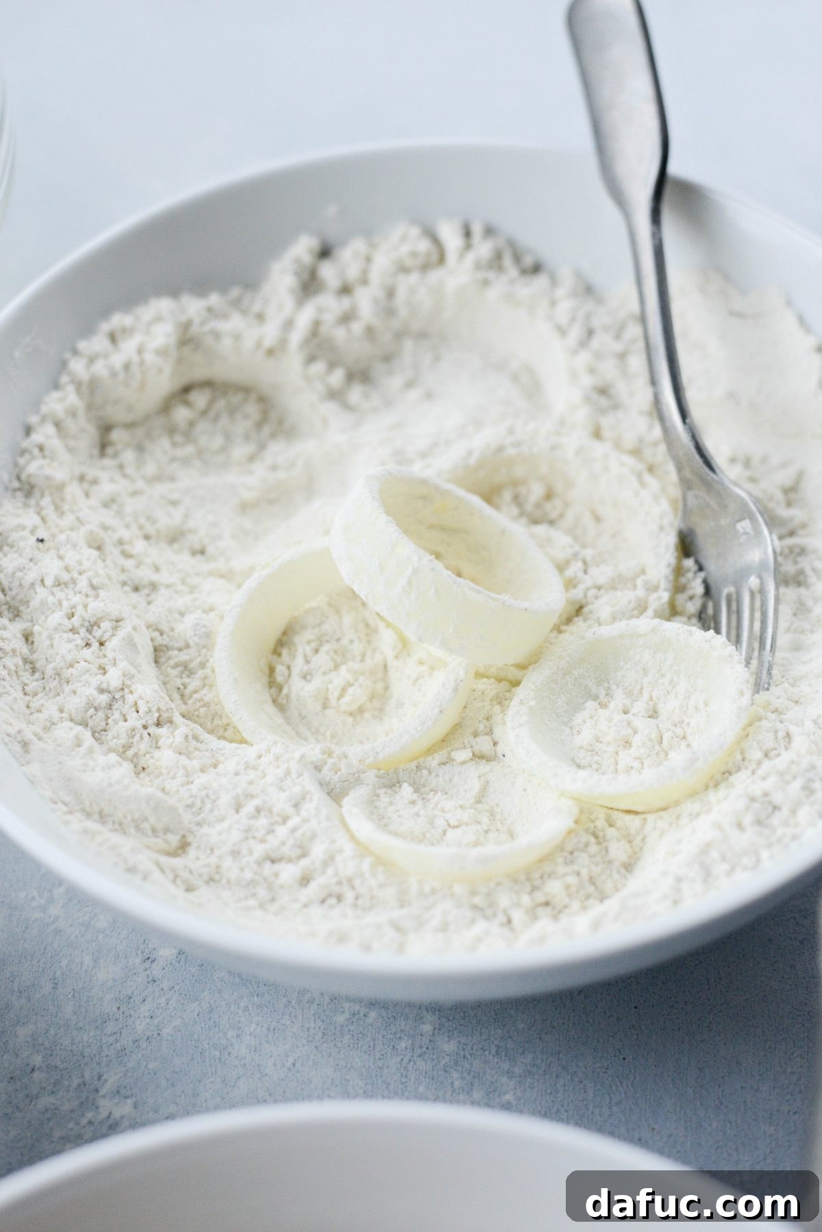 dip thick cut onions first in flour