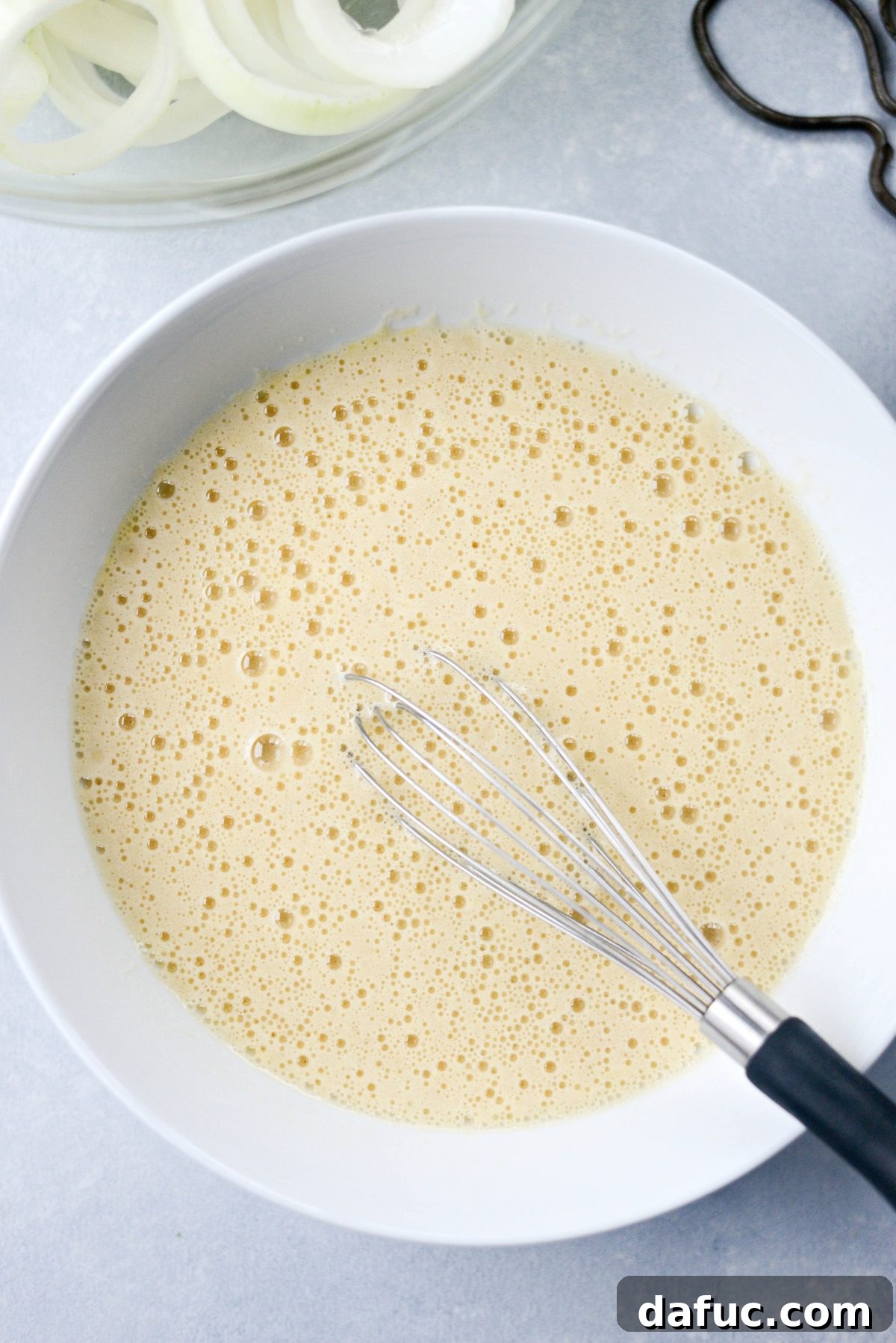 whisked egg and beer in bowl