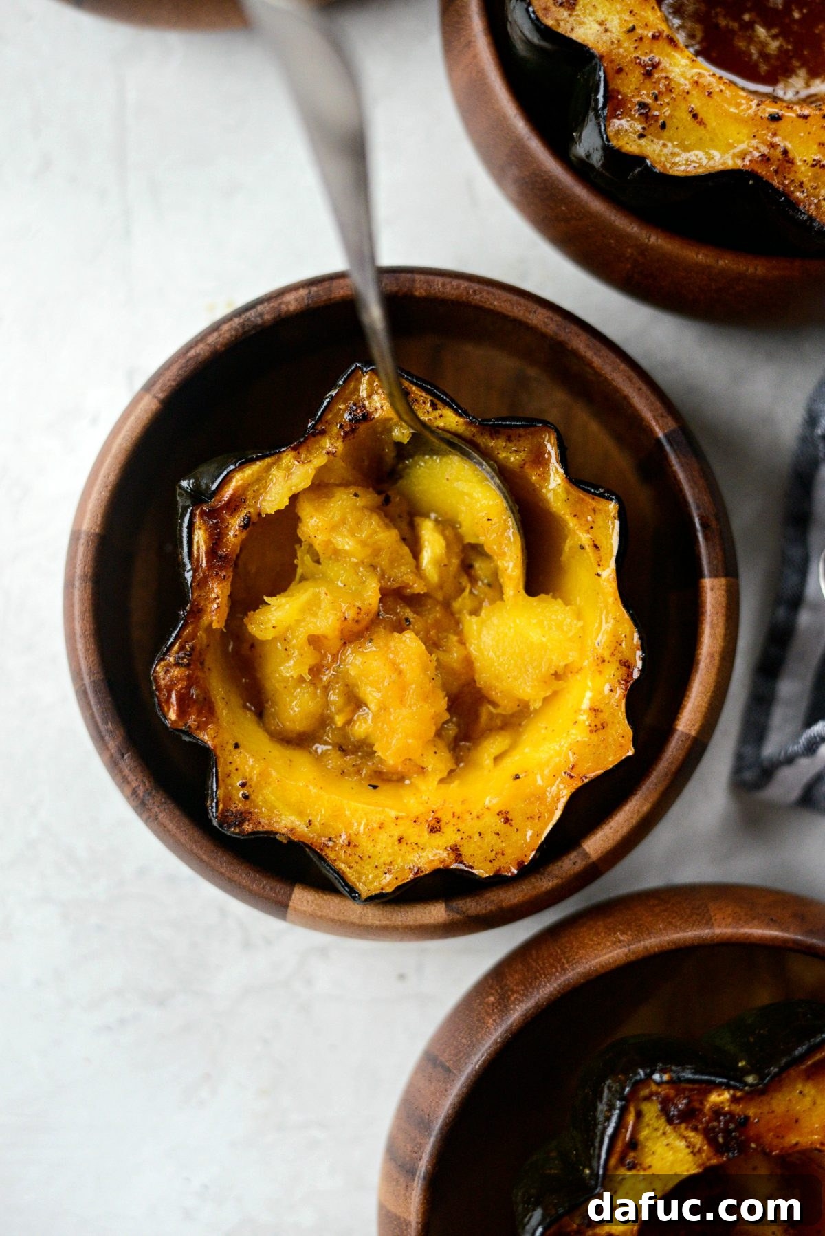 A final close-up shot of the maple butter roasted acorn squash, highlighting its festive appeal and delicious caramelization.