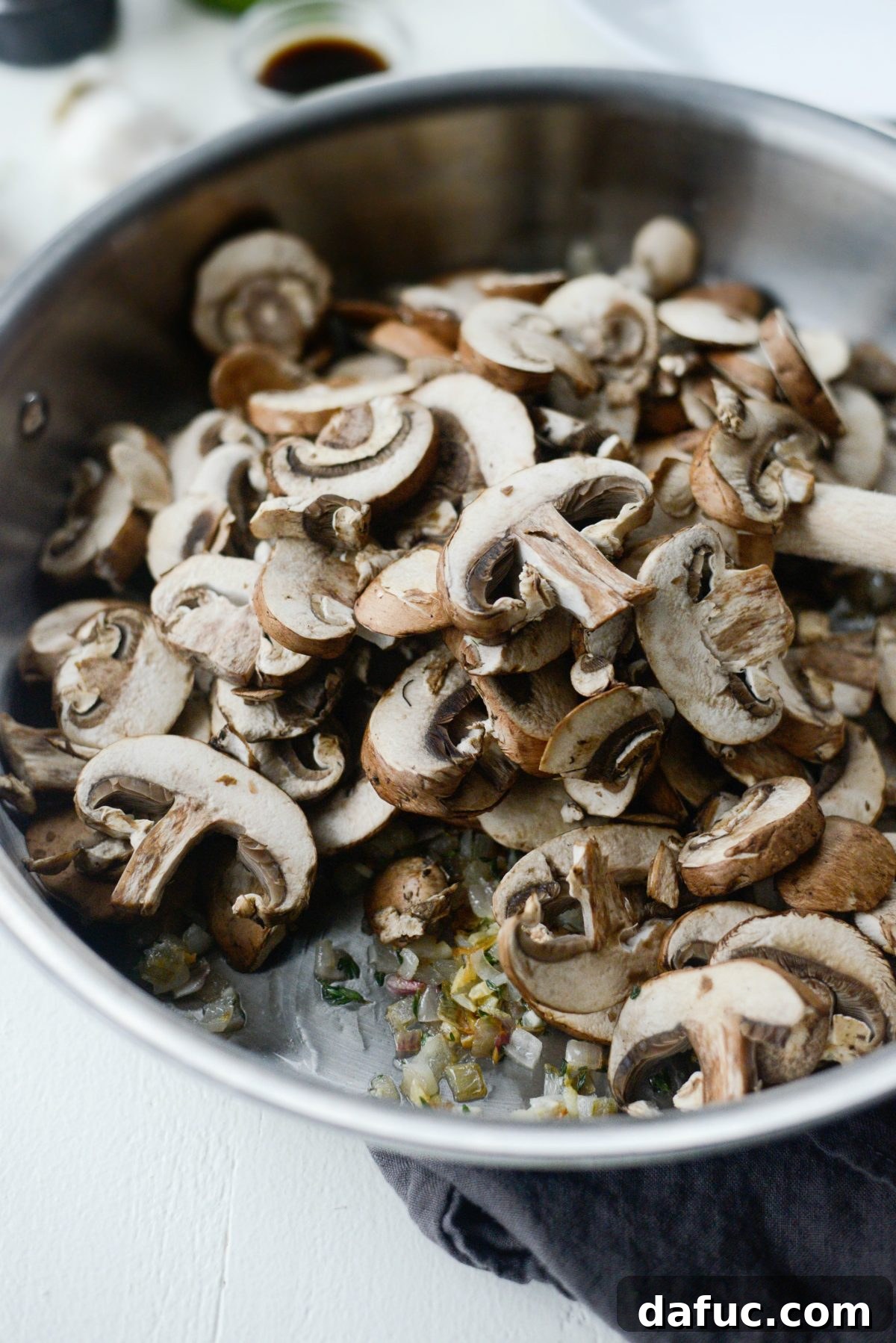 Simple Creamy Mushroom Bliss 7 mushrooms added to pan with garlic and shallots