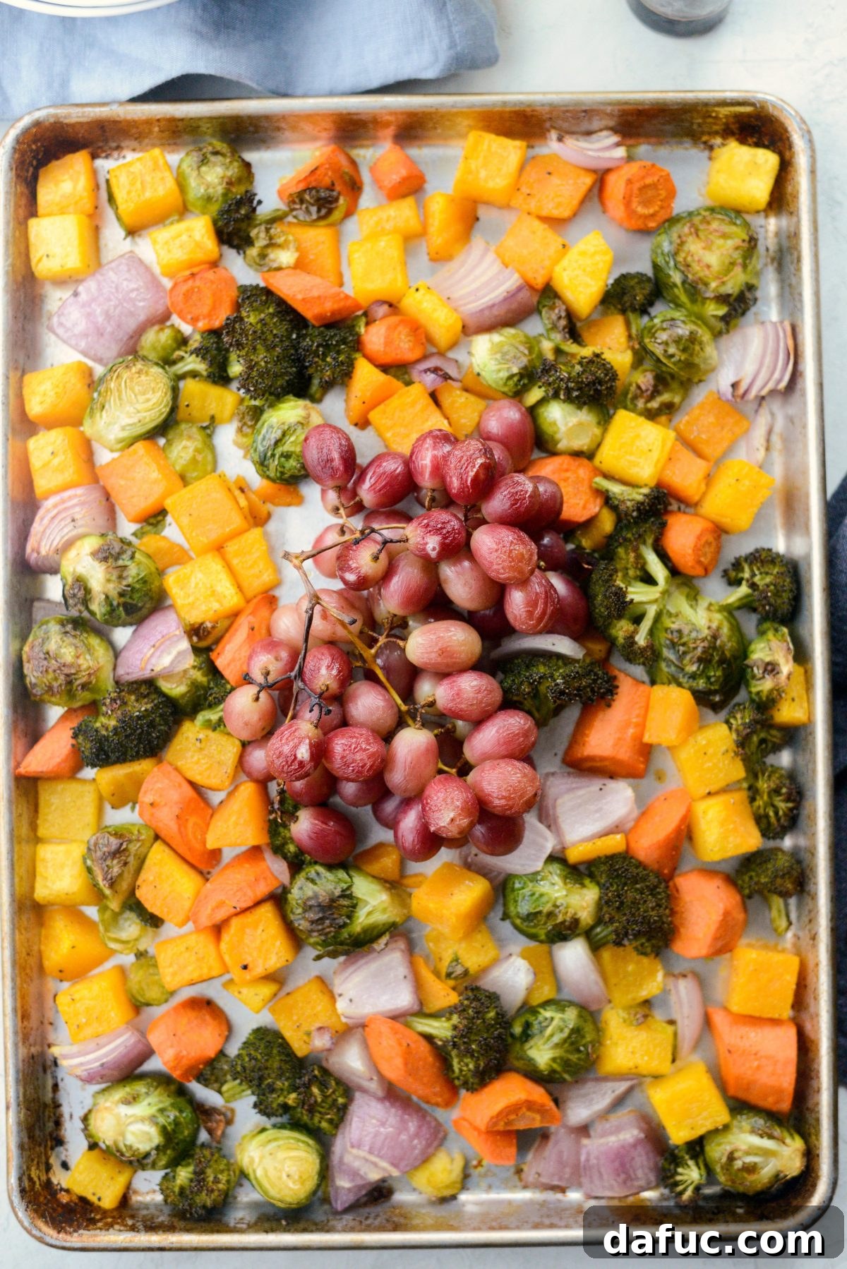 Harvest Roasted Vegetables with Honey Balsamic Glaze on Creamy Goat Cheese Polenta 14 sheet pan of roasted veggies and grapes