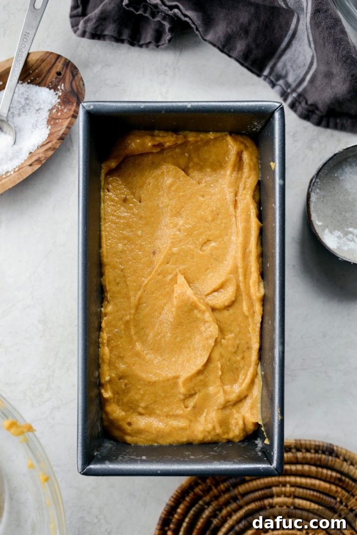 Spiced Pumpkin Ginger Loaf with Luxe Maple Brown Butter Glaze 12 Loaf pan prepared with nonstick spray, ready for pumpkin bread batter. A key step for easy release and perfect results.