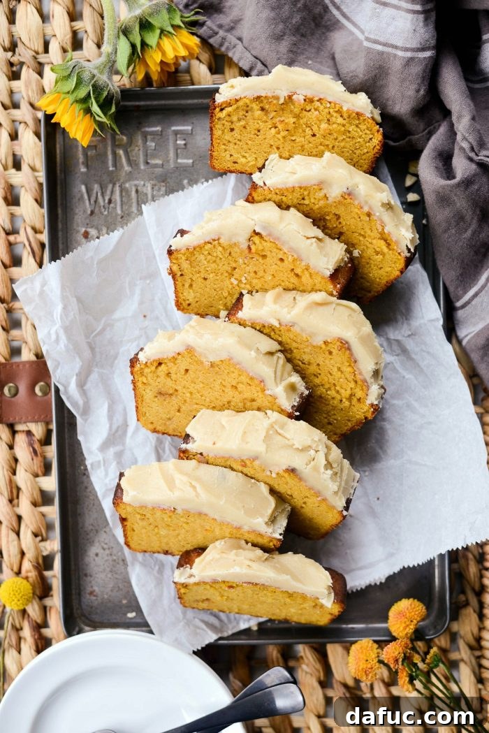 Spiced Pumpkin Ginger Loaf with Luxe Maple Brown Butter Glaze 15 Ginger pumpkin bread with maple brown butter icing being drizzled over the top. Shows the final decadent touch.