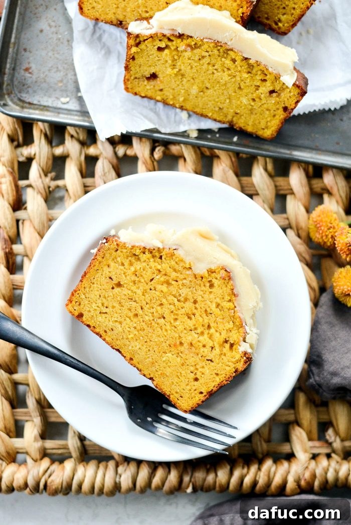 Spiced Pumpkin Ginger Loaf with Luxe Maple Brown Butter Glaze 16 Sliced ginger pumpkin bread with maple brown butter icing, ready to be served. Highlights the delicious layers and inviting presentation.