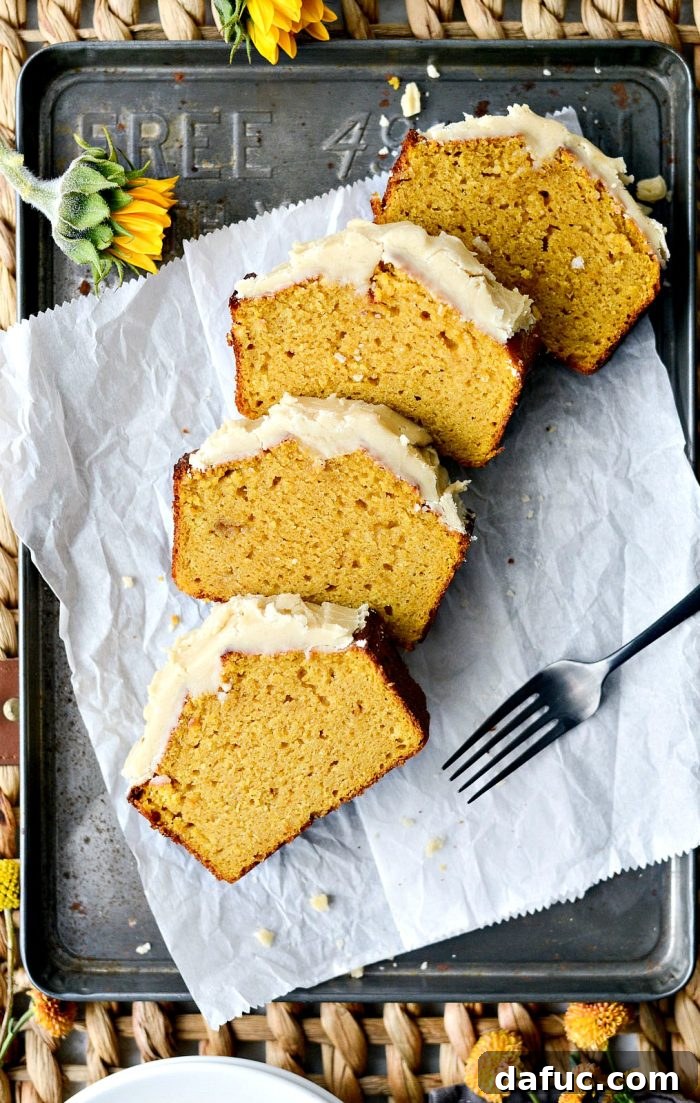Spiced Pumpkin Ginger Loaf with Luxe Maple Brown Butter Glaze 19 Overhead shot of a full ginger pumpkin bread loaf with a generous amount of maple brown butter icing. A stunning fall dessert.