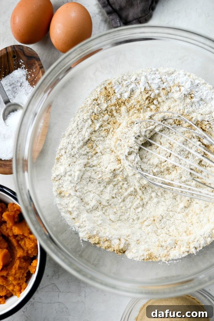 Spiced Pumpkin Ginger Loaf with Luxe Maple Brown Butter Glaze 5 Ingredients for ginger pumpkin bread laid out, including flour, pumpkin puree, ginger, and butter. A visual guide for the recipe prep.