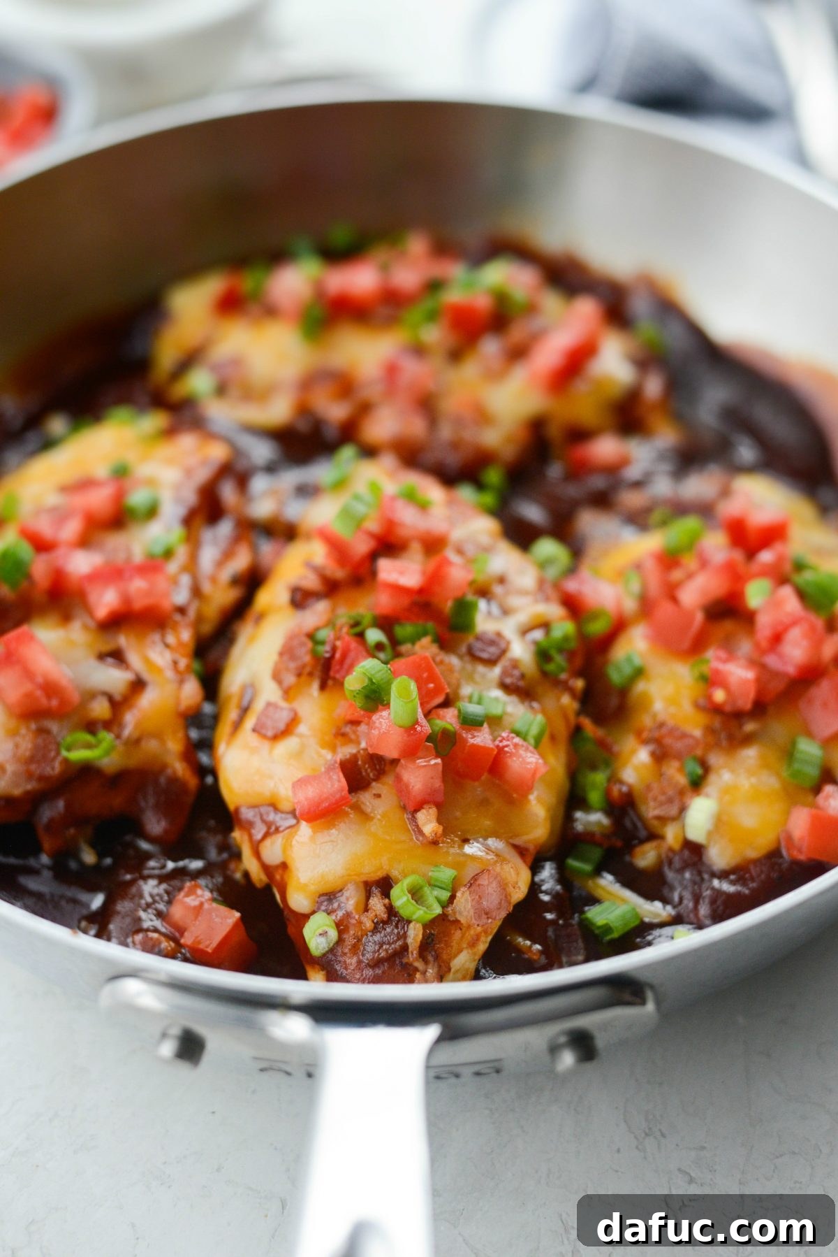 Cheesy Skillet Monterey Chicken 13 Finishing Skillet Monterey Chicken with crispy bacon, diced tomato, and sliced green onion