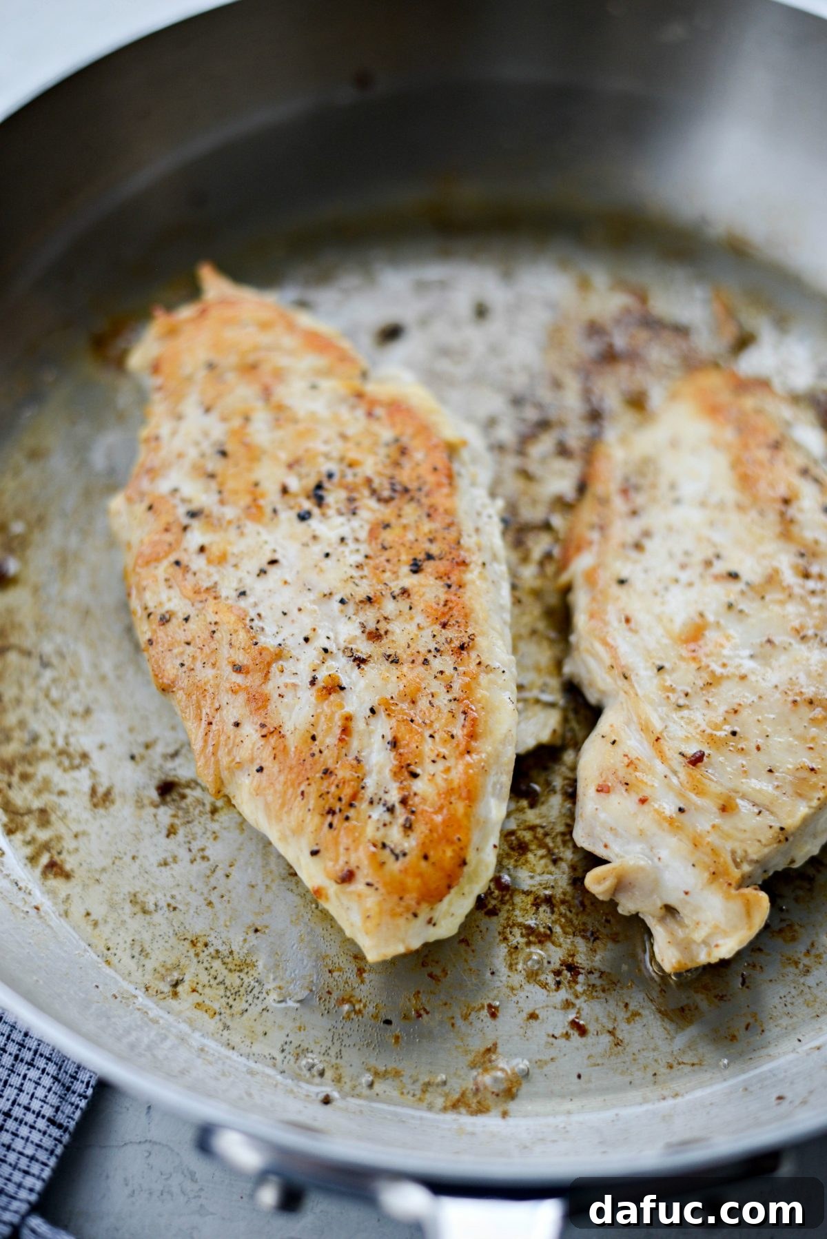 Cheesy Skillet Monterey Chicken 7 Chicken breasts searing in the skillet on both sides