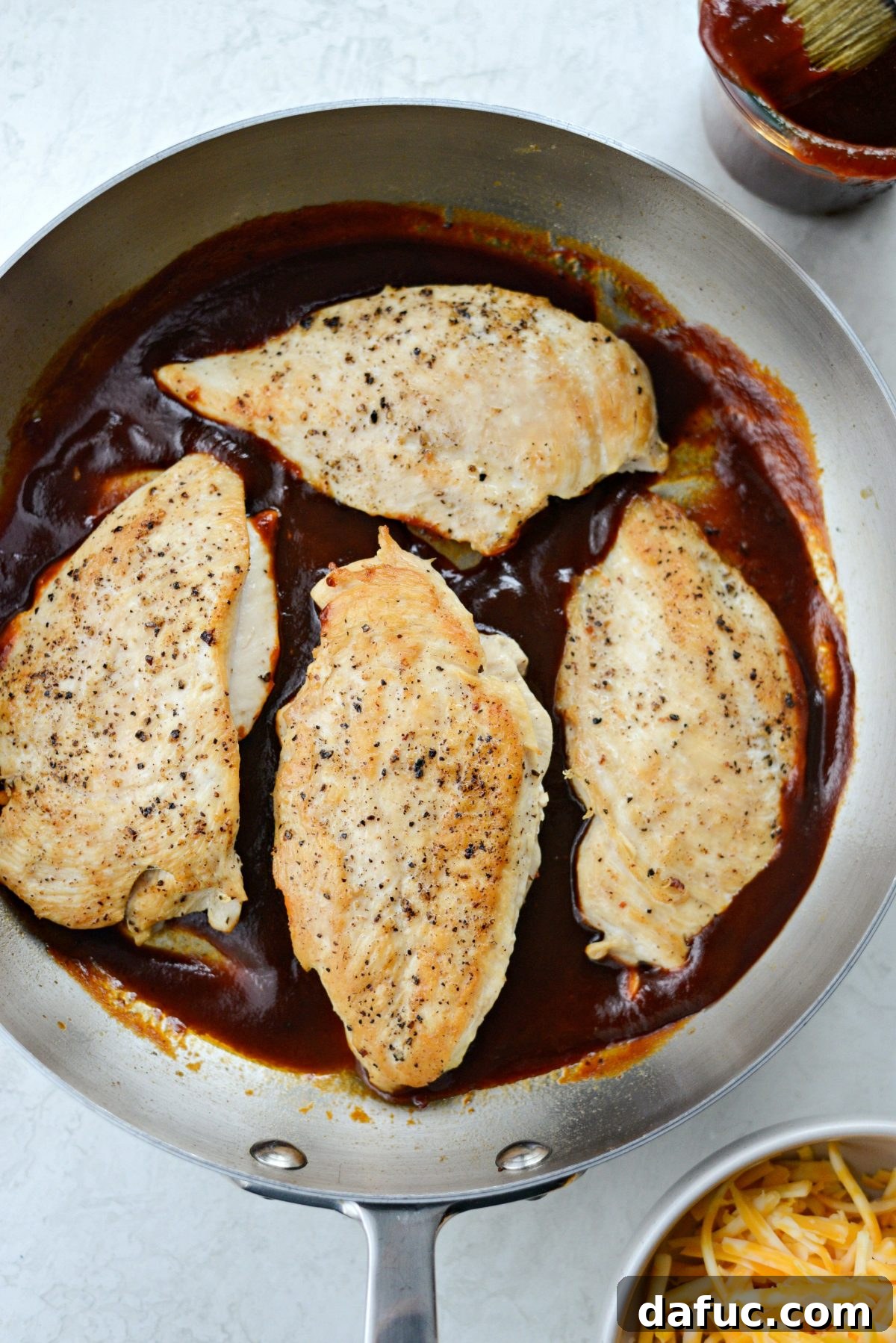 Cheesy Skillet Monterey Chicken 9 Adding cooked chicken breasts back into the skillet with barbecue sauce