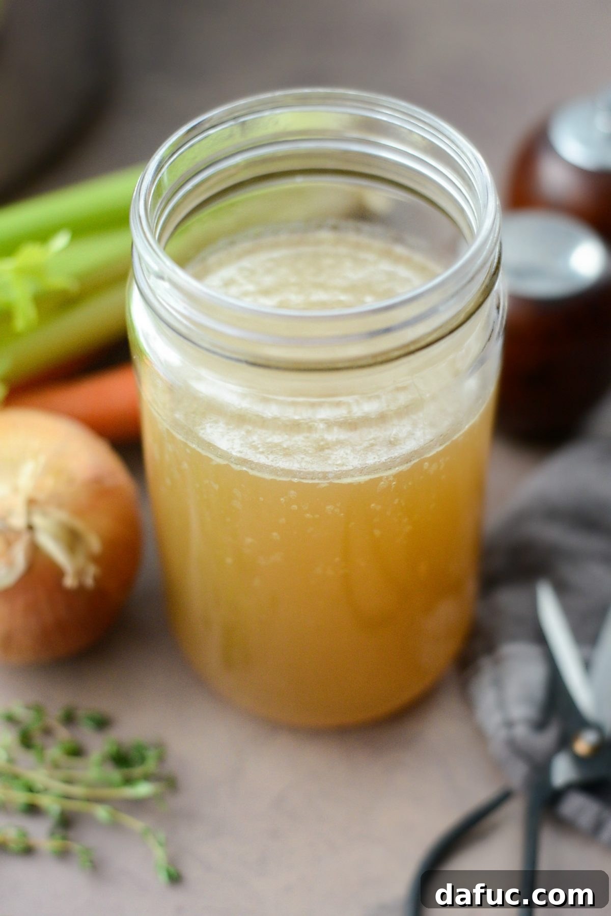 Homemade Turkey Stock in a bowl with a ladle
