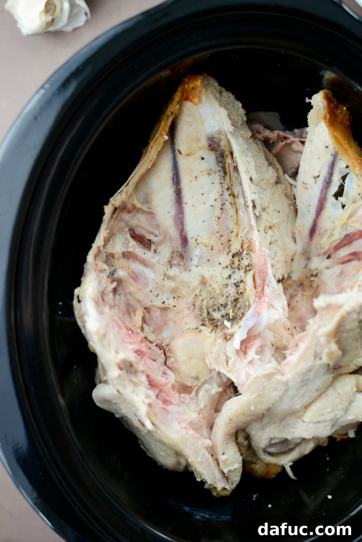 Turkey bones in slow cooker, ready for other ingredients