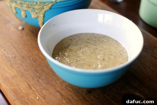A portion of the banana-almond batter transferred to a smaller bowl