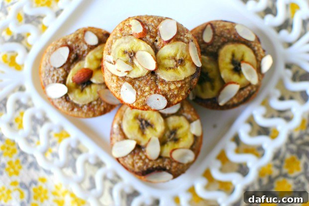 Freshly baked Almond Banana Muffins with a golden crust and chocolate swirl