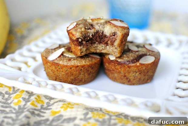 Close-up of baked Almond Banana Muffins on a cooling rack