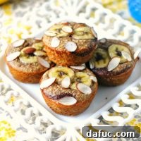Almond Banana Muffins with chocolate swirl, topped with banana slices and almonds