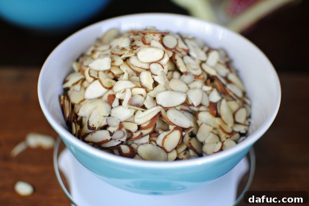 Weighing sliced almonds on a digital kitchen scale