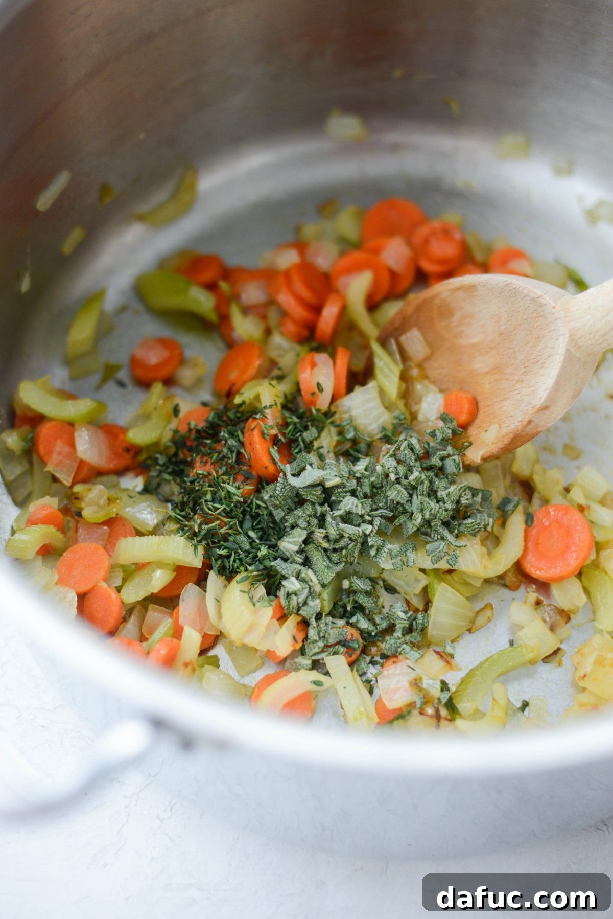 Cozy Turkey Noodle Comfort 7 Adding fresh herbs to vegetables