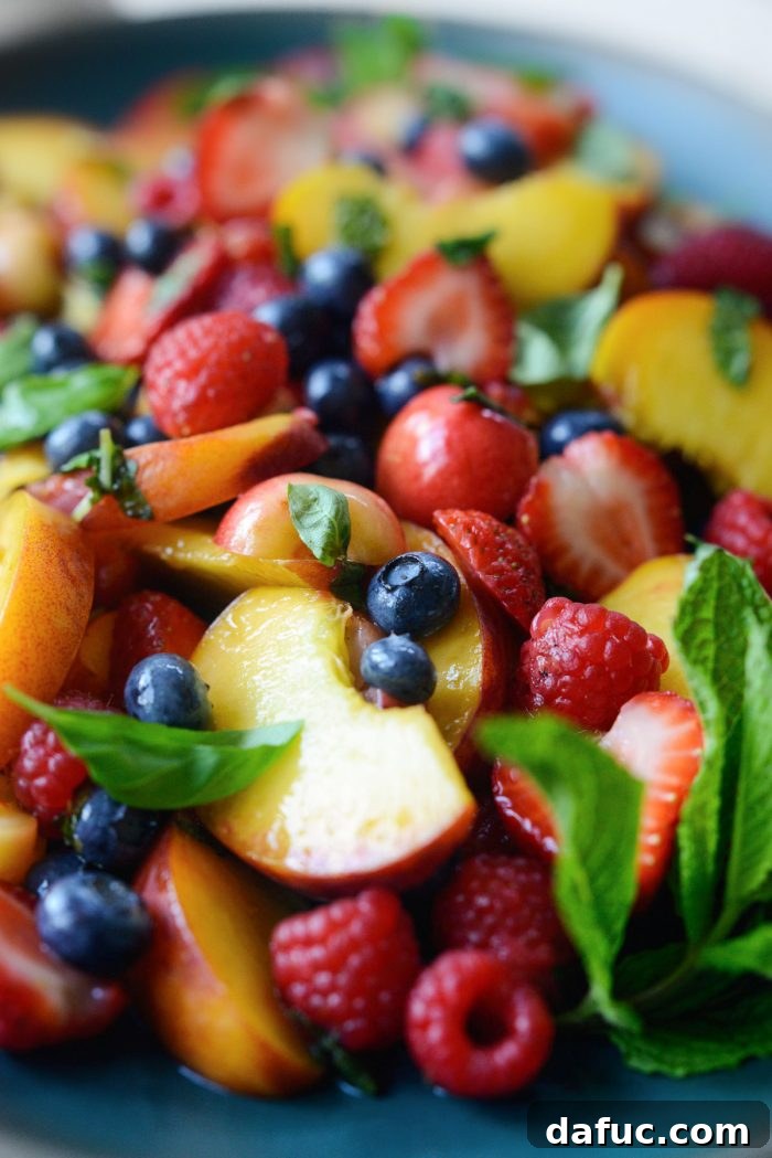 A final, close-up shot of the mouth-watering Summer Fruit Salad, emphasizing its freshness and appeal