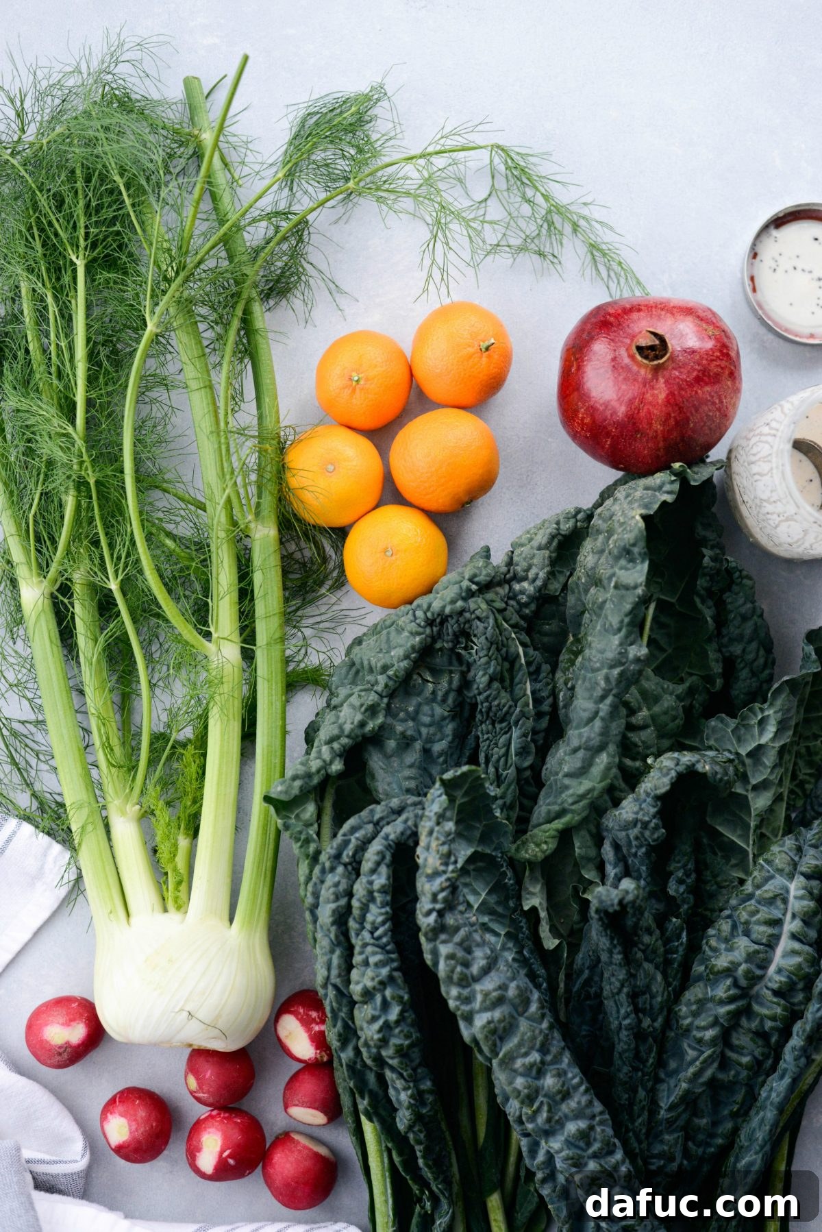 Ingredients for creamy clementine poppy seed dressing in a jar