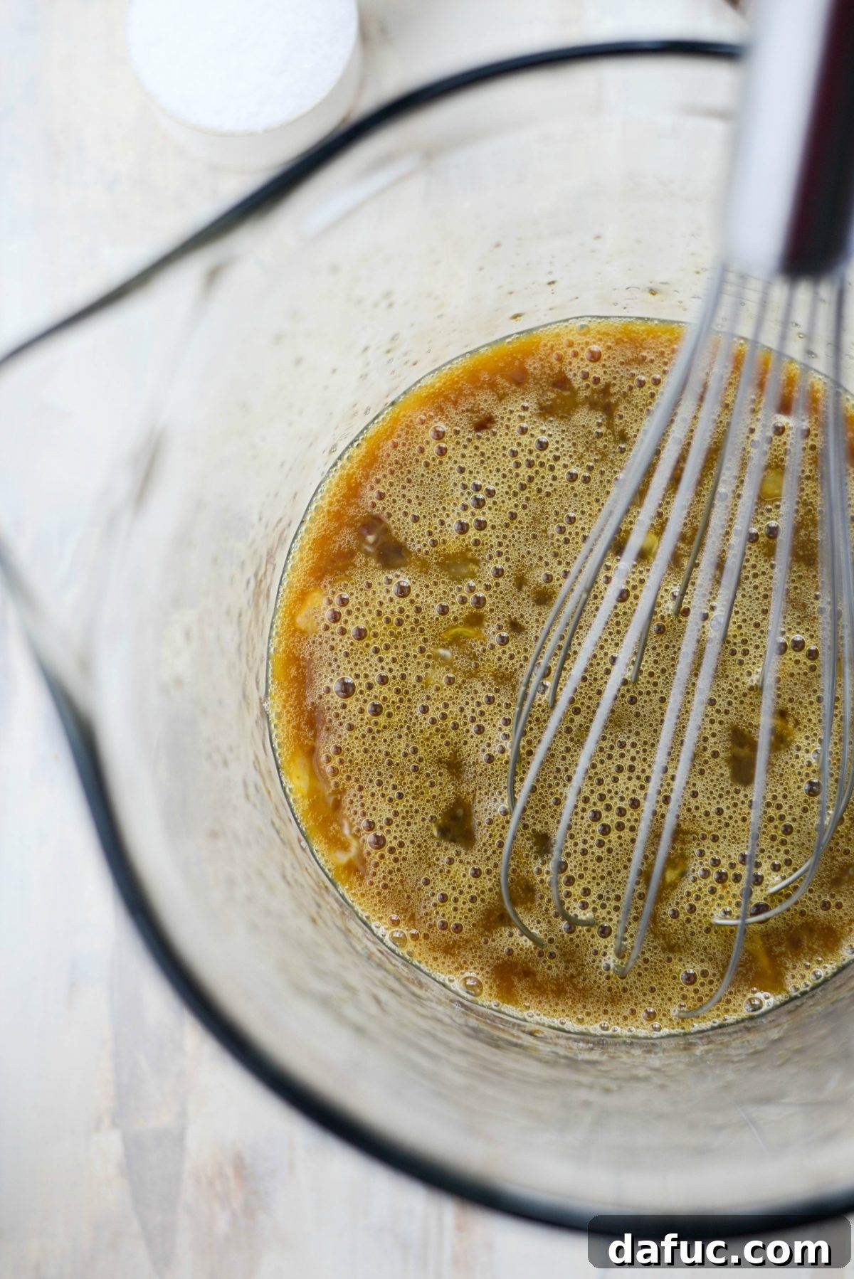 Whisked custard mixture in a bowl