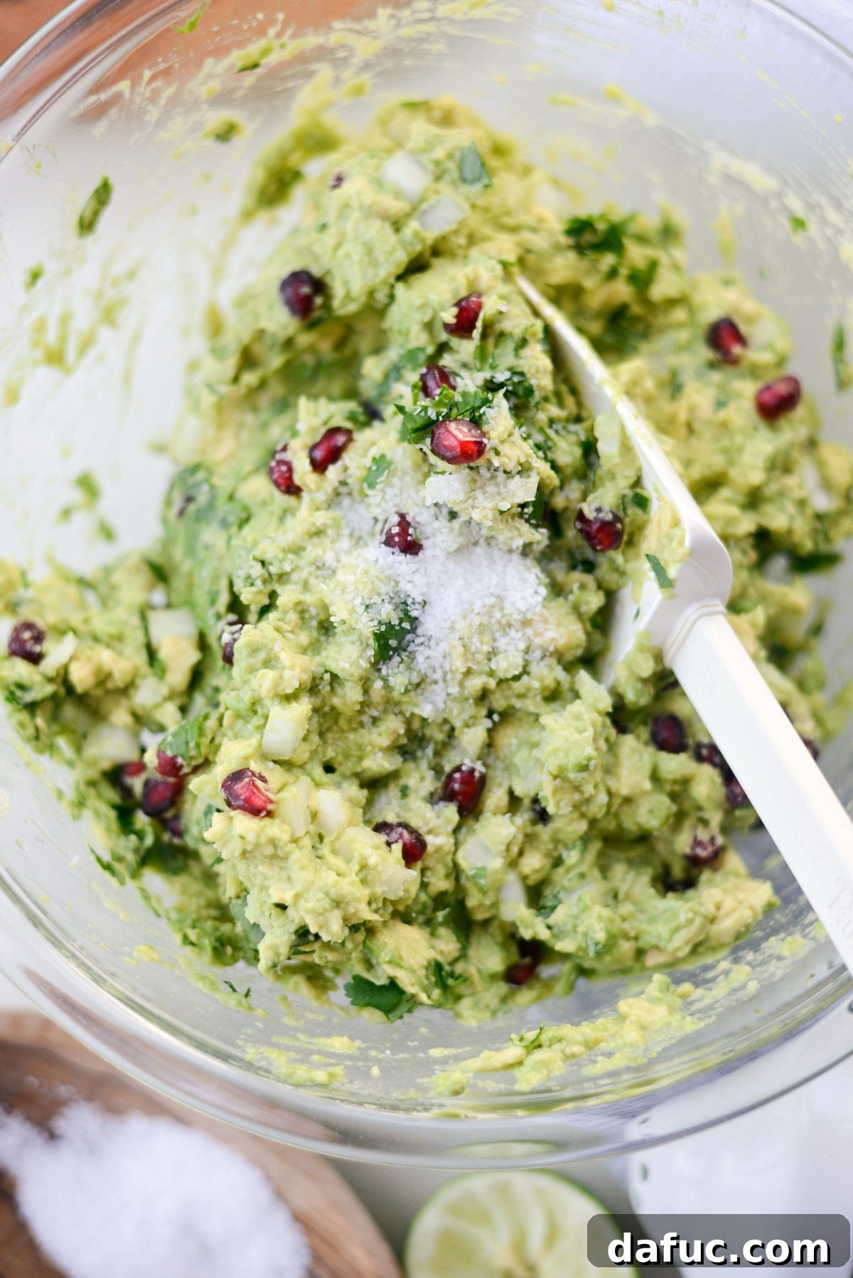 Seasoning the Holiday Guacamole with kosher salt