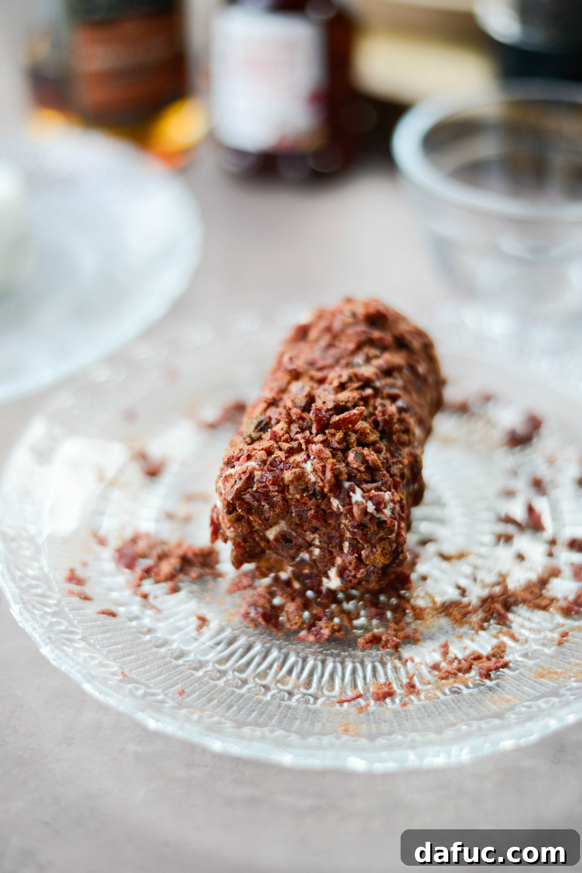 Goat cheese log rolled in cinnamon and nutmeg, then coated with chopped cranberries
