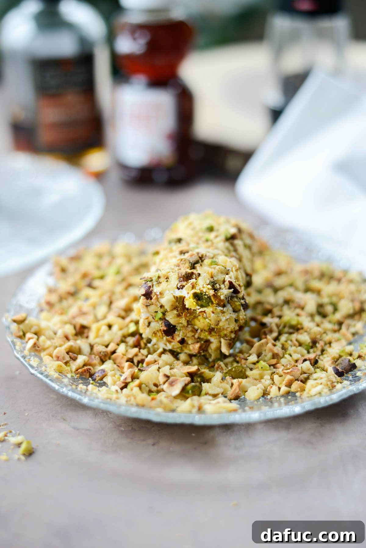 Goat cheese log fully rolled in finely chopped nuts