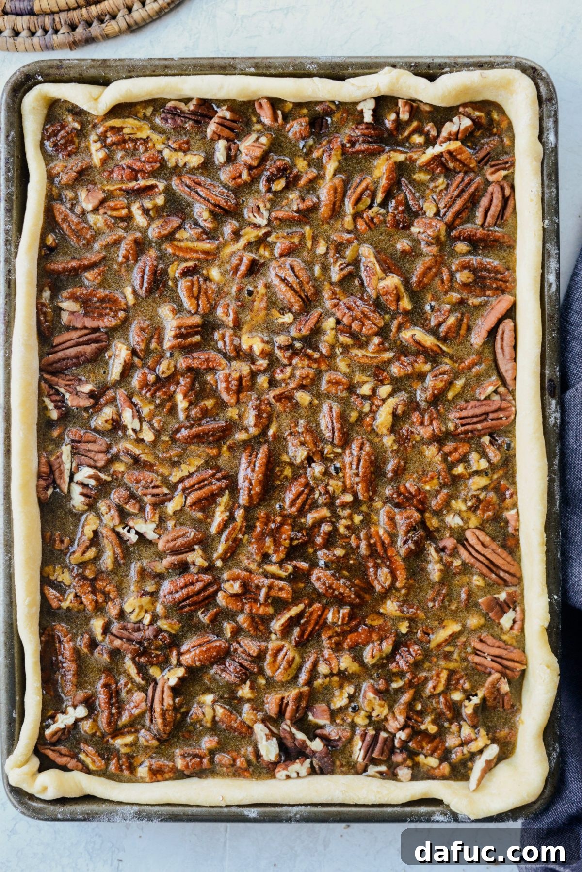 Gingerbread Pecan Slab Pie baking in the oven