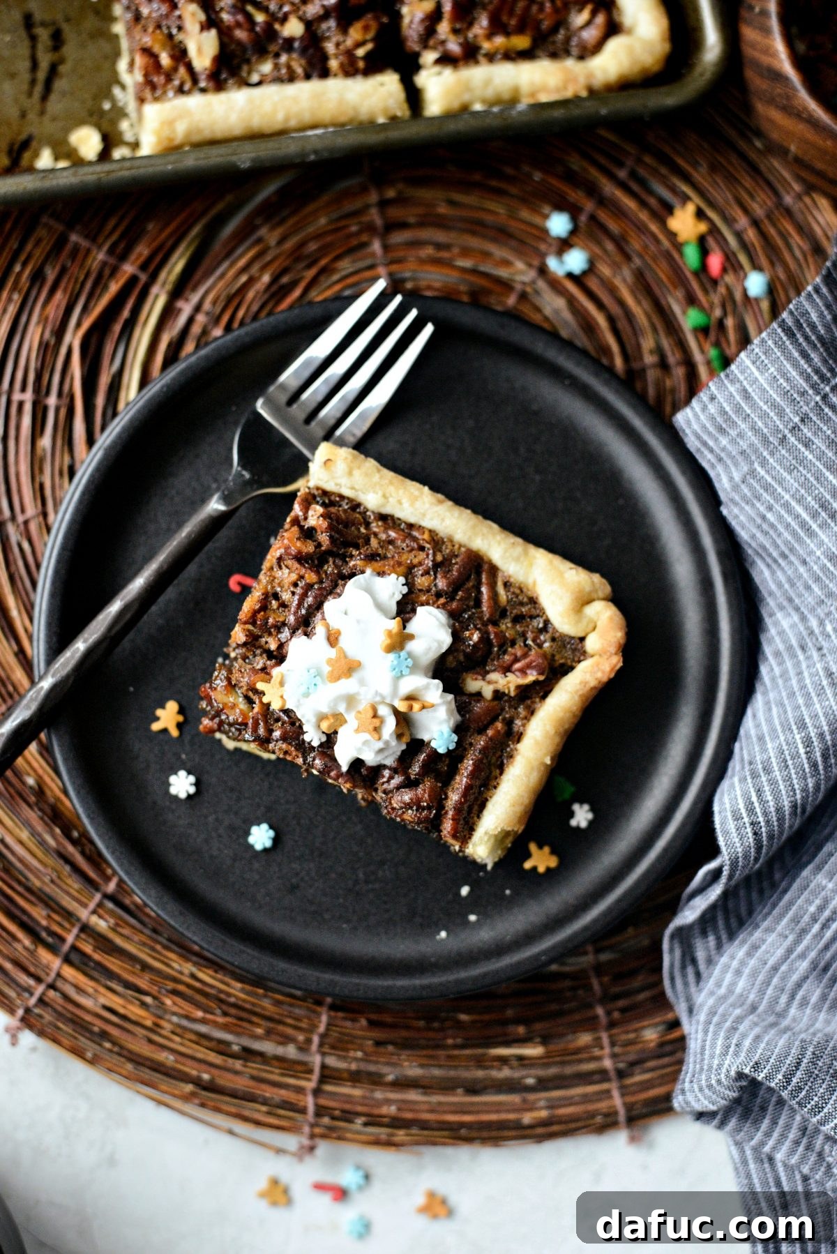 Decorated Gingerbread Pecan Slab Pie with festive sprinkles