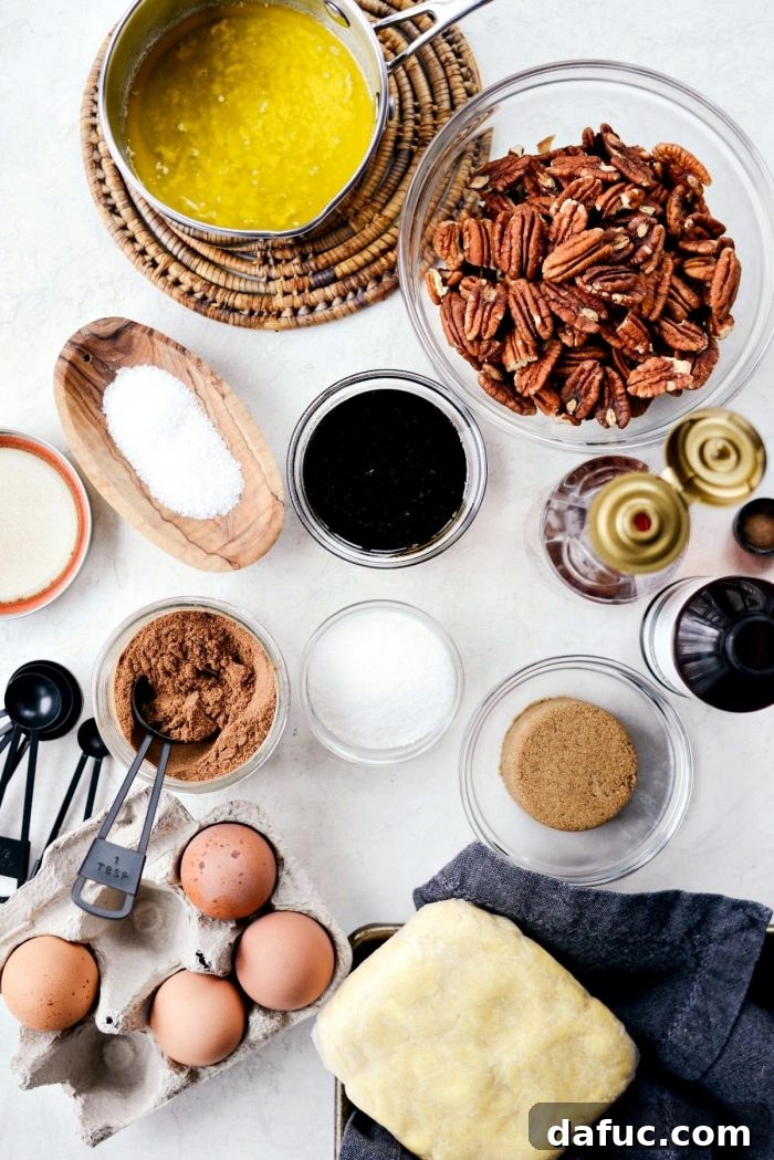 Essential ingredients for Gingerbread Pecan Slab Pie laid out on a table