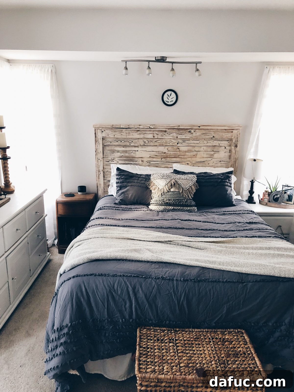 2018 Unpacked 17 A stunning, custom-built wooden headboard, meticulously aged for a unique, timeless appeal.