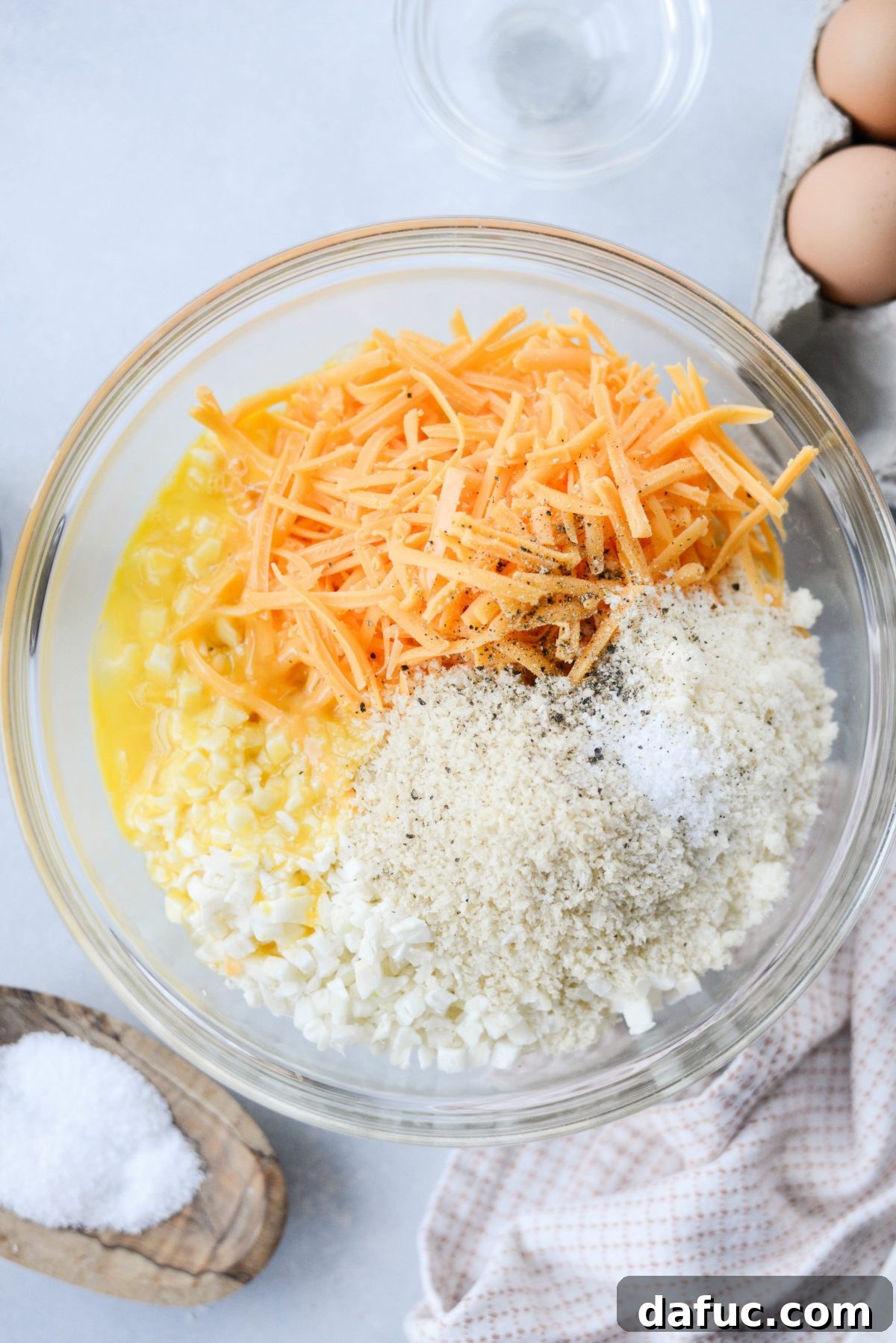 Golden Crispy Cauliflower Hash Browns 5 ingredients for cauliflower hash browns in a bowl