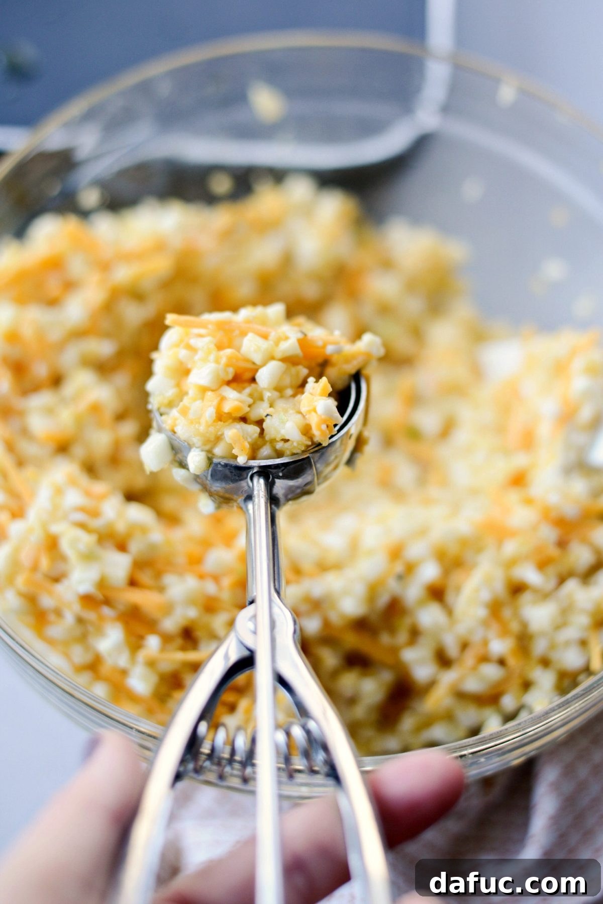 Golden Crispy Cauliflower Hash Browns 7 scoop hash brown mixture onto griddle