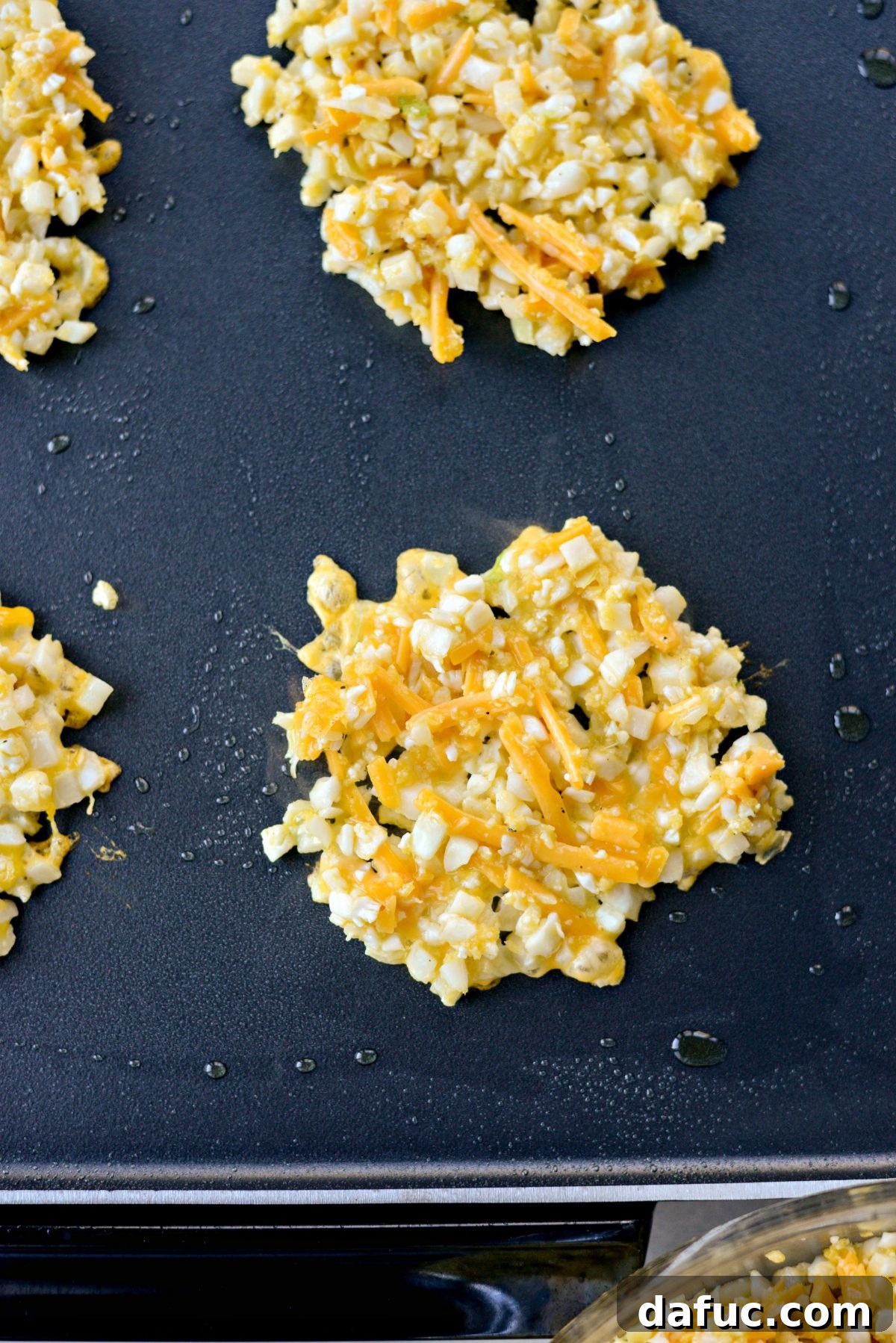 Golden Crispy Cauliflower Hash Browns 8 add and flatten cauliflower hash browns on to a hot griddle
