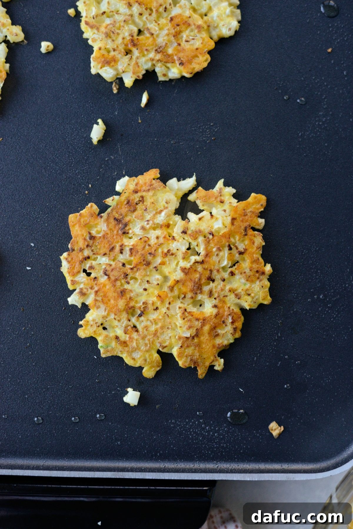 Golden Crispy Cauliflower Hash Browns 9 flip and cook cauliflower hash browns on the second side.