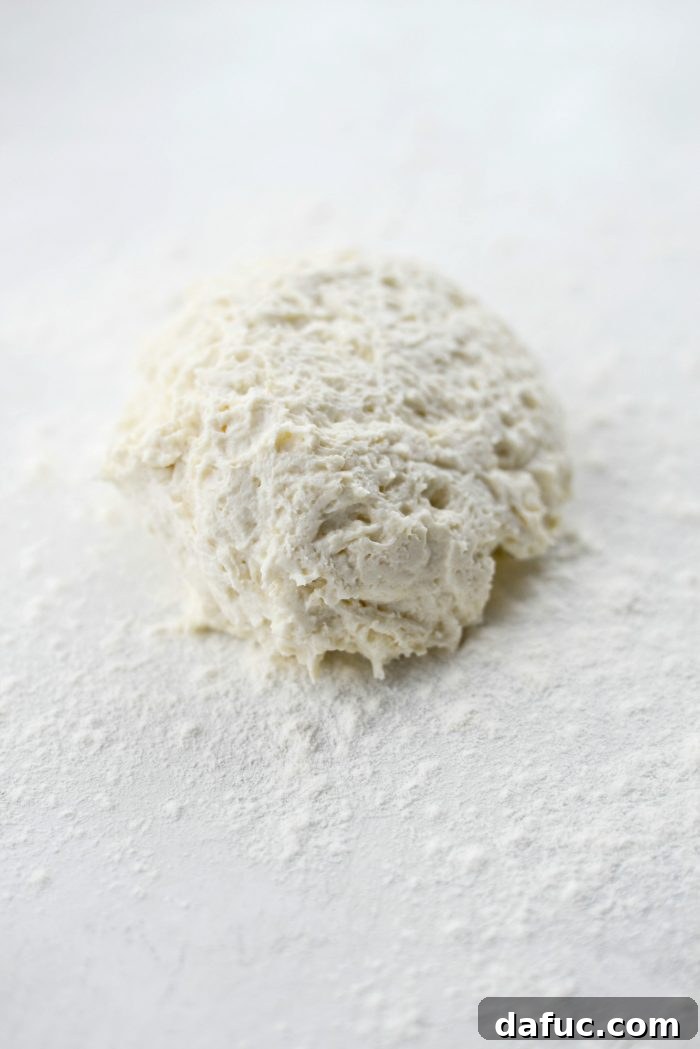Transferring the Greek yogurt pizza dough onto a generously floured surface