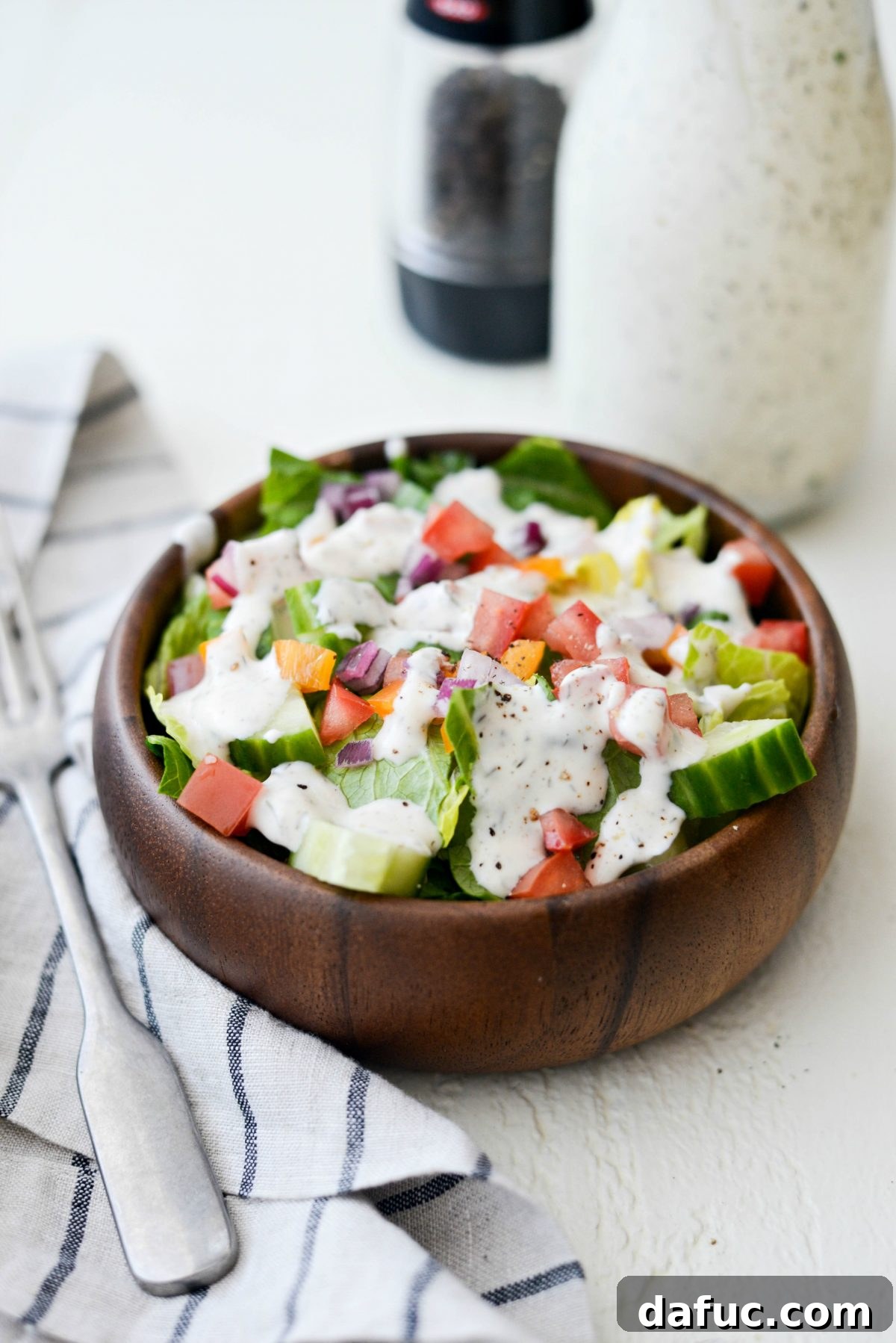 Greek Yogurt Ranch Dressing Drizzled Over a Fresh Salad
